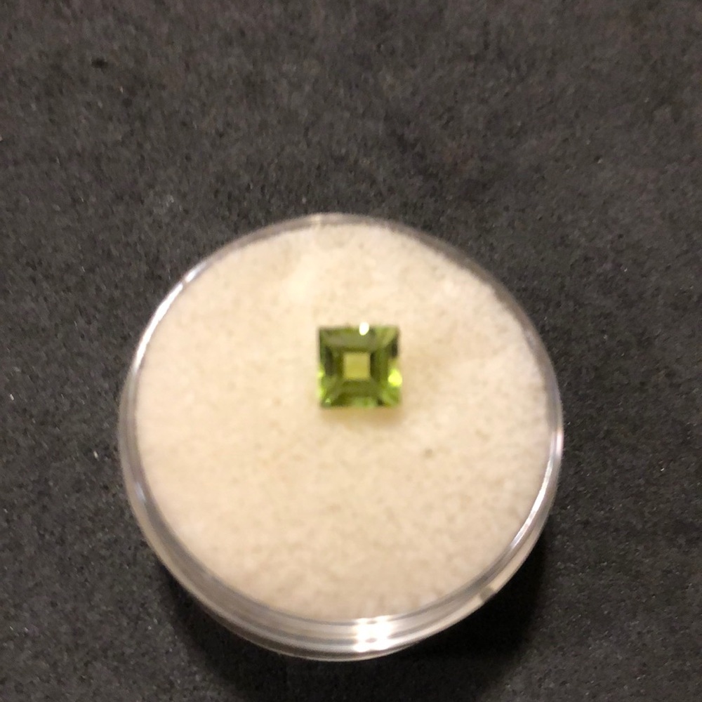 Loose stone peridot. Princess cut 5x5x4.5 deep. Approximately.75 carats.